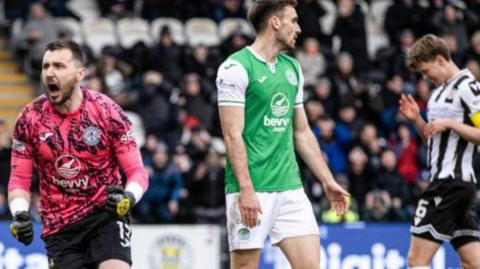 Hibernian goalkeeper Jordan Smith celebrates a save