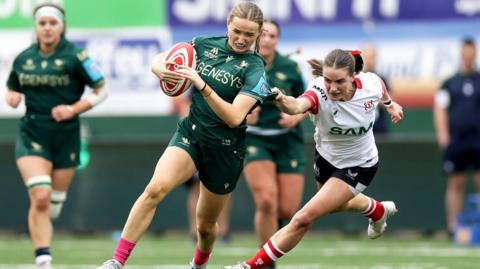 Hannah Clarke is tackled by Kate Farrell-McCabe
