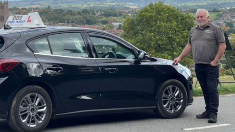 Naughton Dunn with his car