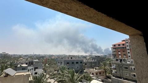 Smoke rises during strikes amid the Israeli military operation in Deir Al-Balah, in central Gaza