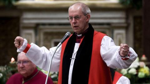 Justin Welby wearing clerical robes in St Paul's Basilica outside in Rome, Italy