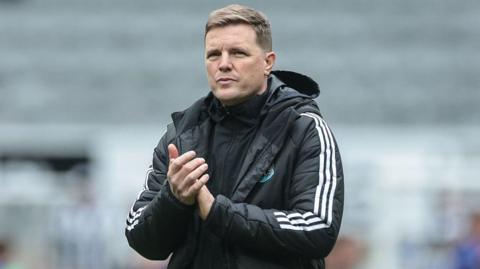 Eddie Howe applauds Newcastle United supporters after the defeat against Sunderland at St James' Park on 22 March 2026