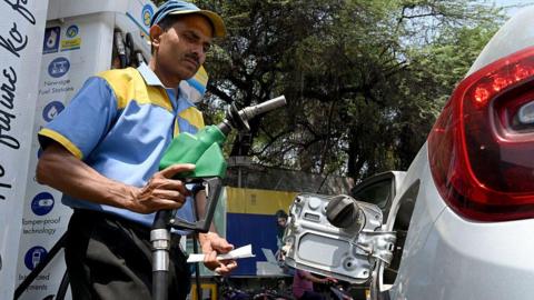 A petrol pump attendant fills fuel in a vehicle at a petrol station, on 16 May, 2026 in New Delhi, India.