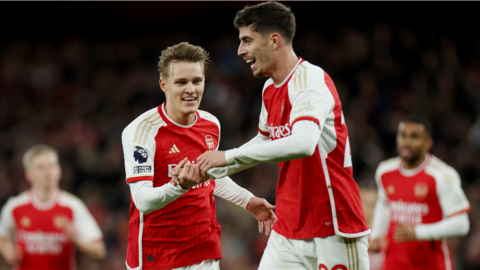 Martin Odegaard (left) celebrates scoring for Arsenal against Luton Town