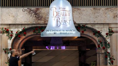 A movie advertising board at shopping mall in Kuala Lumpur, Malaysia, advertising the film Beauty and the Beast. March 14, 2017.