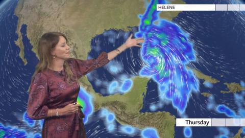 A weather forecaster indicates a weather front in the South East of the US