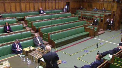 Sammy Wilson, Jim Shannon, Boris Johnson and a small number of MPs on the green benches in the House of Commons