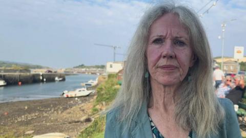 Mayor of Hayle June Lawrenson-Reid standing in front of Hayle harbour 