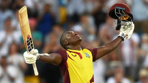 West Indies batter Rovman Powell celebrates hitting a century against England in the third T20