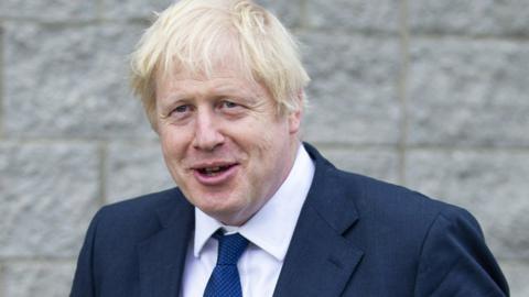 Britain's Prime Minister Boris Johnson leaves after visiting Peterhead Fish Market in Peterhead,