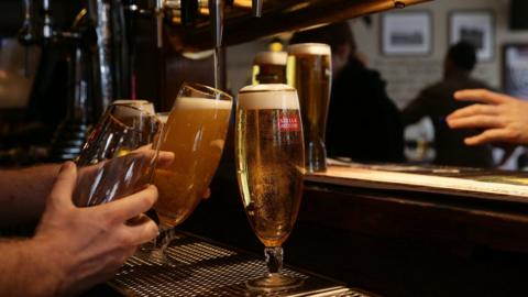 Beer being poured in a pub