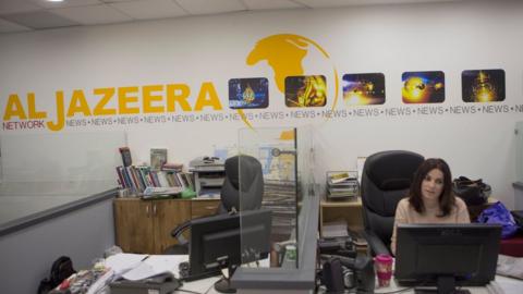 Employees of Al Jazeera satellite channel work at their Jerusalem bureau, Israel, 14 June 2017