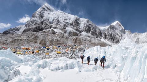 Climbers leaving base camp