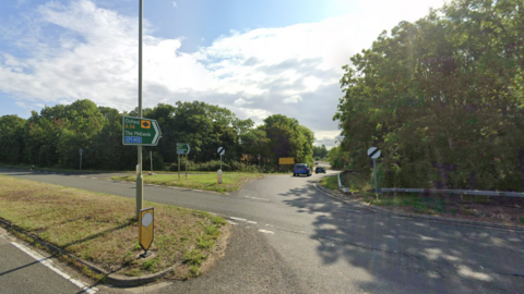 A screenshot from Google street view showing a junction with a slip road that goes on to join an A-road.