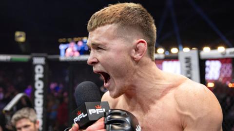 Paul Hughes shouts into a PFL microphone in the cage