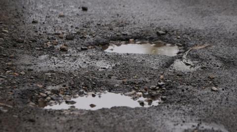 Pothole in road