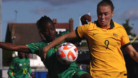 Fikile Magama of South Africa and Caitlin Foord of Australia battle for the ball