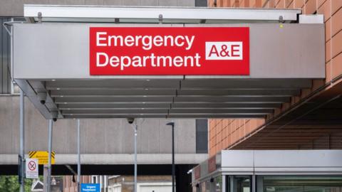 Sign outside a hospital entrance reading: "Emergency Department"