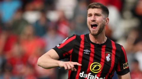 Chris Mepham shouts and gesticulates during a match for Bournemouth