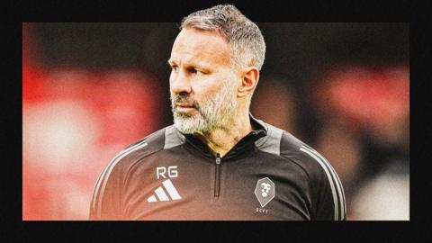 A framed image of Ryan Giggs in Salford coaching kit