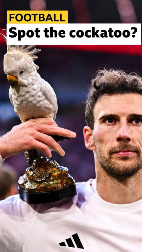 Leon Goretzka of Bayern Munich with cockatoo mascot