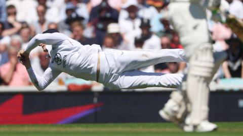 England's Jacob Bethell takes a diving catch to remove New Zealand captain Tom Latham