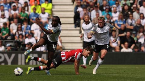 Derby County's David Ozoh is tackled by Sheffield United's Oliver Arblaster