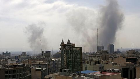 Smoke rises after an airstrike in Tehran