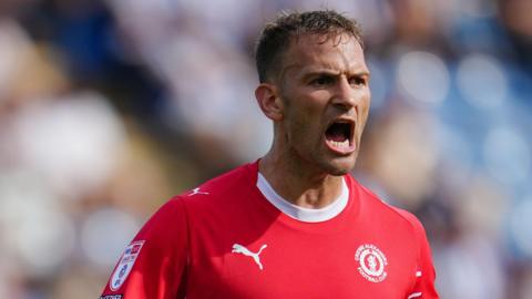 Mickey Demetriou shouts at team-mates during a match for Crewe