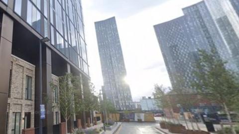 Sunlit high rise buildings in 'Silvercroft street, Manchester