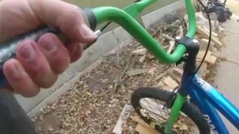 Police officer holding a child's bike