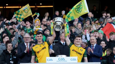 Donegal's joint captains Michael Langan and Shane O'Donnell lift the Mícheál Ó Muircheartaigh Memorial Cup