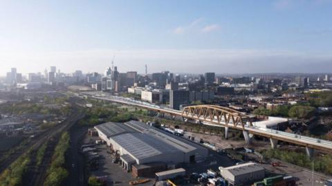 Artist impression of the HS2 viaduct being built in Birmingham. The bridge can be seen in the foreground against the Birmingham skyline