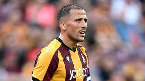 Antoni Sarcevic playing for Bradford City with the captain's armband on his left sleeve