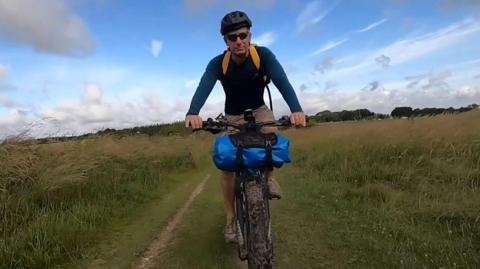 Jon Cuthill riding a mountain bike