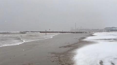 Snow fall at beach in Houston, Texas.