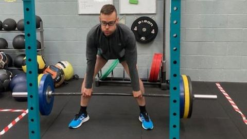 Andrew deadlifting weights in gym