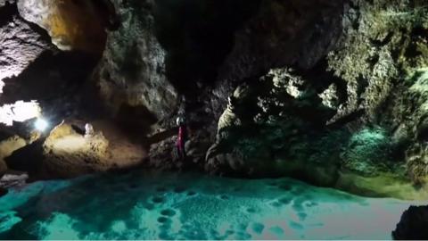 Climber in cave hall