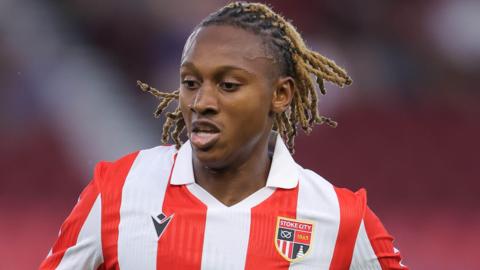 Lamine Cisse wearing Stoke City's red and white home shirt during a pre-season friendly against Everton in July 2026