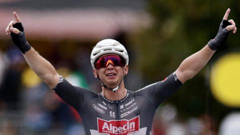 Kaden Groves celebrates winning stage 20 of the Tour de France