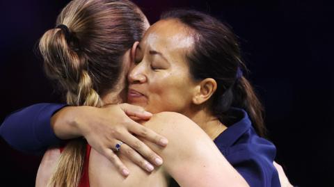 Anne Keothavong hugs Olivia Nicholls after BJK Cup defeat