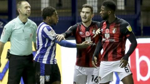 Sheffield Wednesday's Kadeem Harris (left) was sent off for a challenge on Jefferson Lerma shortly after the alleged biting incident