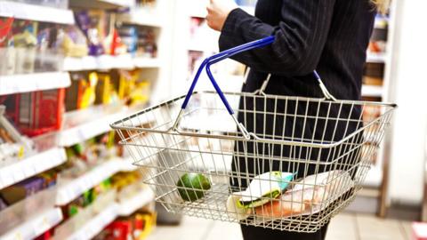 A person shops in a supermarket