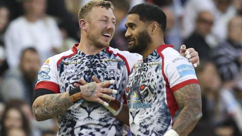 Josh Charnley and Ricky Leutele celebrate for Leigh