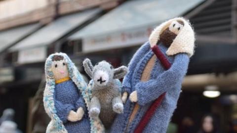 Miniature knitted figures of Mary, Joseph and the donkey