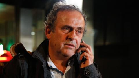 Michel Platini leaves a police station in Nanterre where he was questioned