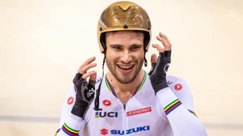 Italy's Filippo Ganna celebrates after winning gold in the men's 4km individual pursuit in a record time at the Track World Cup in Minsk