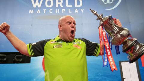 Michael van Gerwen celebrating with his World Matchplay title