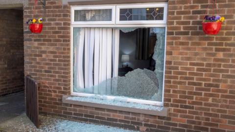 Smashed window at Newtownards gun attack