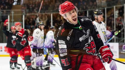 Cole Sanford celebrates a goal for Cardiff Devils